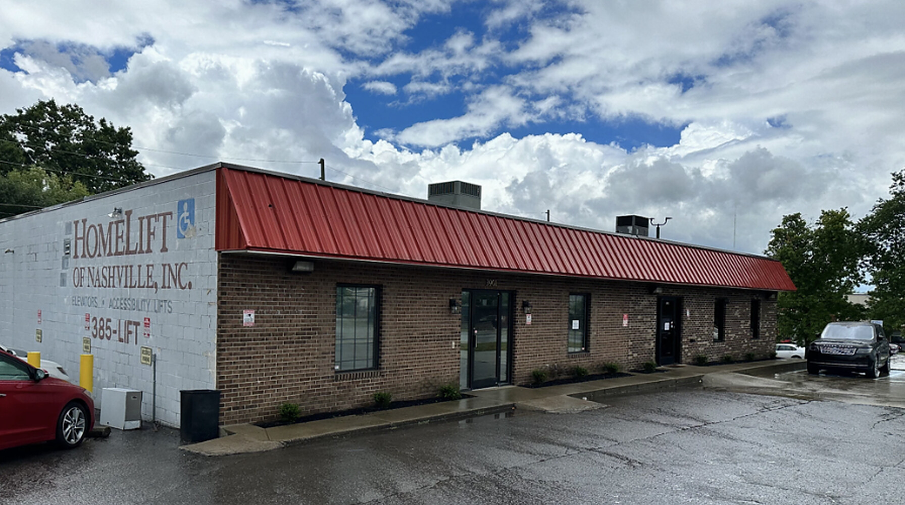 3901-3905 Charlotte Avenue street frontage with red metal awning and brick facade